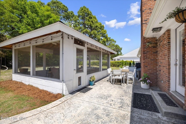 125 Windemere Rd, Wilmington, NC 28405 - view of patio featuring a sunroom and outdoor dining space