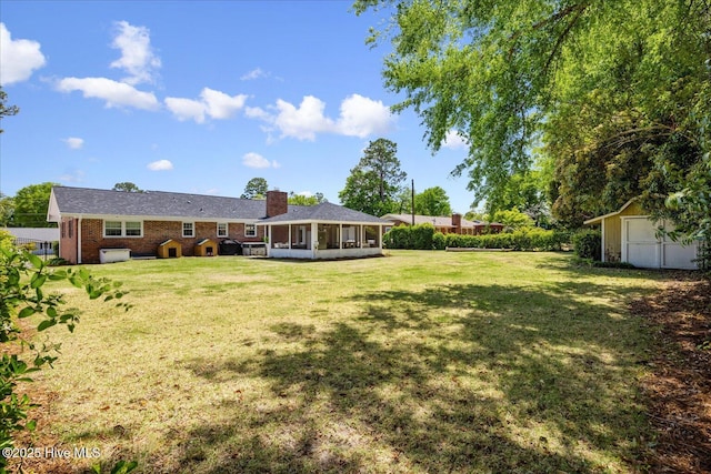 125 Windemere Rd, Wilmington, NC 28405 - view of green lawn featuring a sunroom and a shed