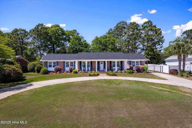 125 Windemere Rd, Wilmington, NC 28405 - ranch-style home with a porch, brick siding, and driveway