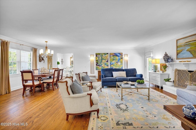 125 Windemere Rd, Wilmington, NC 28405 - living area with crown molding, light wood-type flooring, and a chandelier