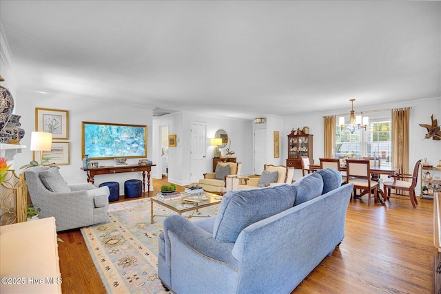 125 Windemere Rd, Wilmington, NC 28405 - living room featuring a chandelier and light wood-style floors