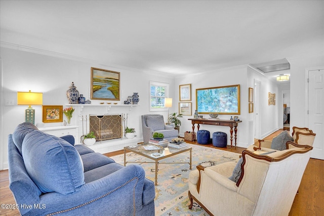 125 Windemere Rd, Wilmington, NC 28405 - living area with ornamental molding, wood finished floors, and a fireplace with raised hearth