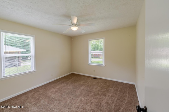 608 Richardson St, Elizabethtown, NC 28337 - carpeted spare room featuring ceiling fan, baseboards, and a textured ceiling