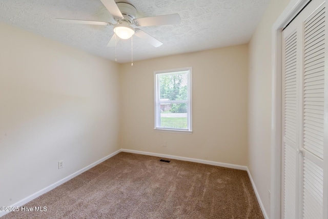 608 Richardson St, Elizabethtown, NC 28337 - unfurnished bedroom with carpet, a closet, a textured ceiling, baseboards, and ceiling fan