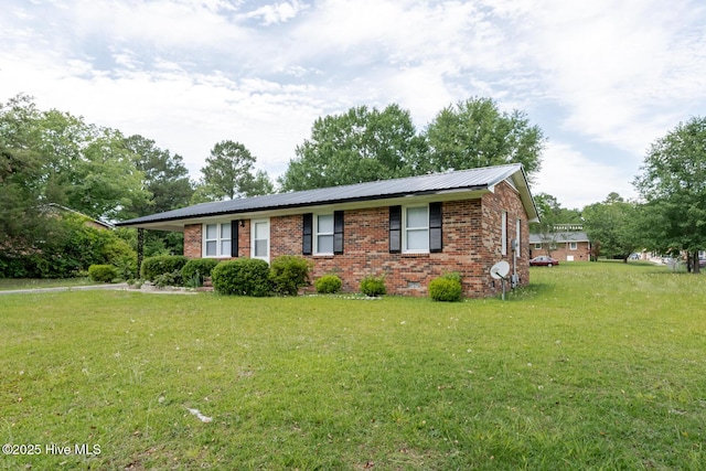 608 Richardson St, Elizabethtown, NC 28337 - ranch-style house with brick siding, a front yard, and metal roof
