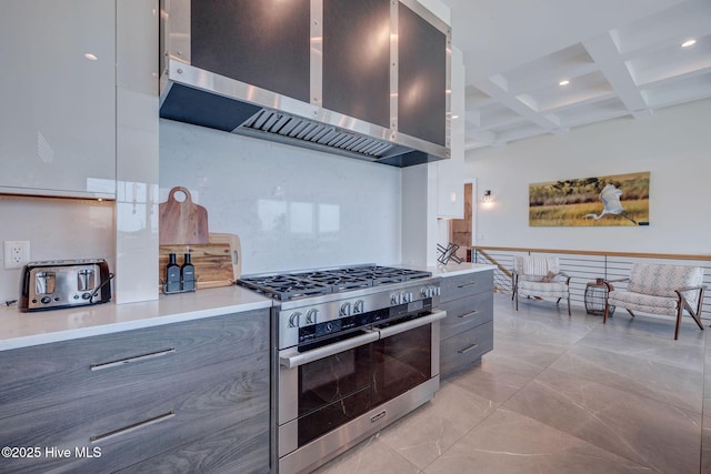 1326 Tidalwalk Dr, Wilmington, NC 28409 - kitchen with range with two ovens, exhaust hood, modern cabinets, coffered ceiling, and beamed ceiling