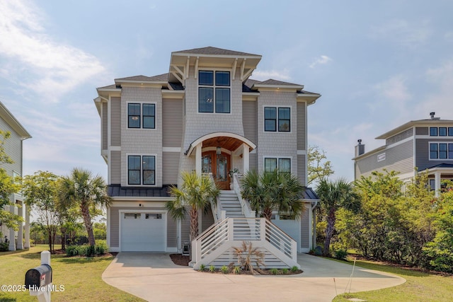 1326 Tidalwalk Dr, Wilmington, NC 28409 - raised beach house featuring stairs, driveway, a front lawn, and a garage