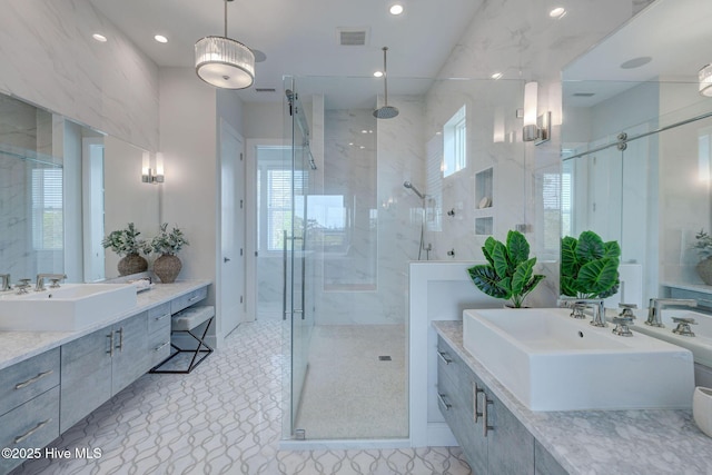 1326 Tidalwalk Dr, Wilmington, NC 28409 - bathroom featuring a shower stall, recessed lighting, two vanities, and baseboards