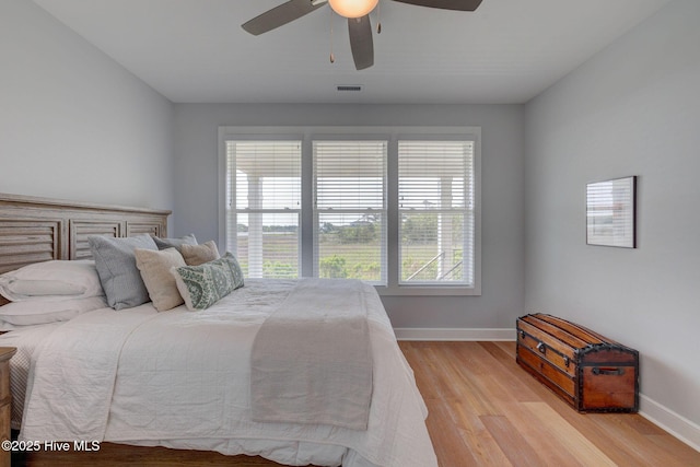 1326 Tidalwalk Dr, Wilmington, NC 28409 - bedroom featuring light wood-style flooring, baseboards, and ceiling fan