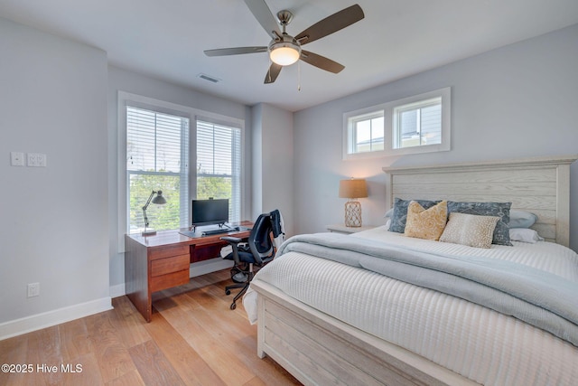 1326 Tidalwalk Dr, Wilmington, NC 28409 - bedroom featuring baseboards, an office area, light wood-style floors, and ceiling fan