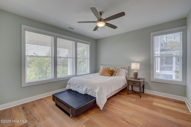 1326 Tidalwalk Dr, Wilmington, NC 28409 - bedroom with light wood finished floors, baseboards, and ceiling fan
