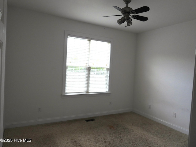 644 Milton Dr, Winterville, NC 28590 - spare room with baseboards, a ceiling fan, and light carpet