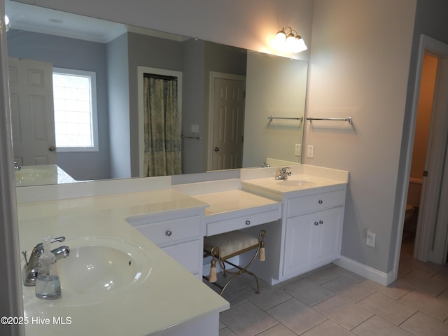 644 Milton Dr, Winterville, NC 28590 - full bath with tile patterned floors, double vanity, and baseboards