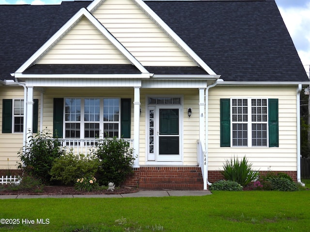 644 Milton Dr, Winterville, NC 28590 - bungalow-style home with covered porch, a front yard, roof with shingles, and entry steps