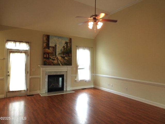 644 Milton Dr, Winterville, NC 28590 - unfurnished living room featuring ceiling fan, wood finished floors, a premium fireplace, lofted ceiling, and baseboards