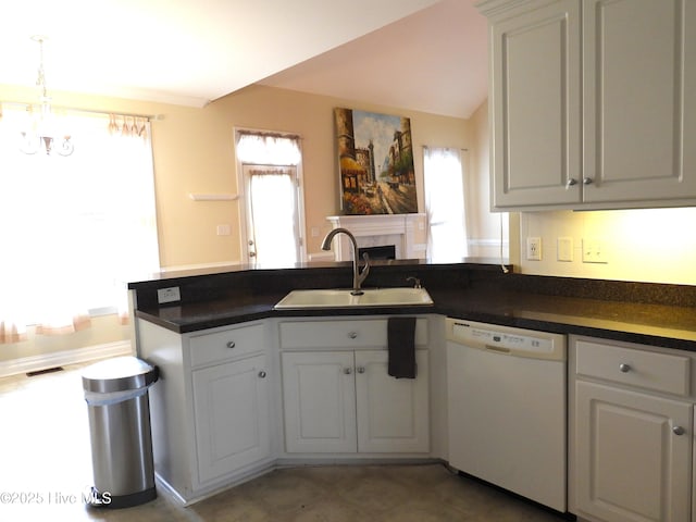 644 Milton Dr, Winterville, NC 28590 - kitchen featuring white dishwasher, a sink, a peninsula, and dark countertops