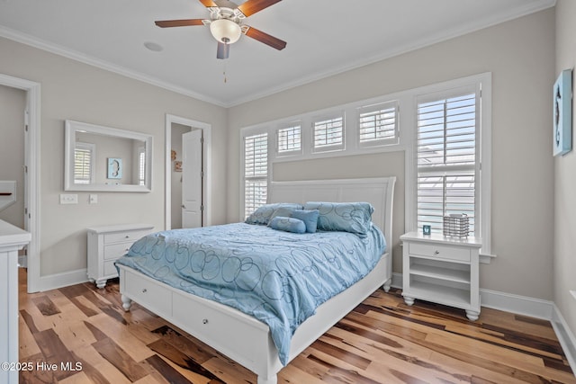 1218 Pinfish Ln, Carolina Beach, NC 28428 - bedroom featuring light wood-style floors, crown molding, baseboards, and a ceiling fan