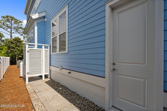 1218 Pinfish Ln, Carolina Beach, NC 28428 - view of exterior entry with central AC