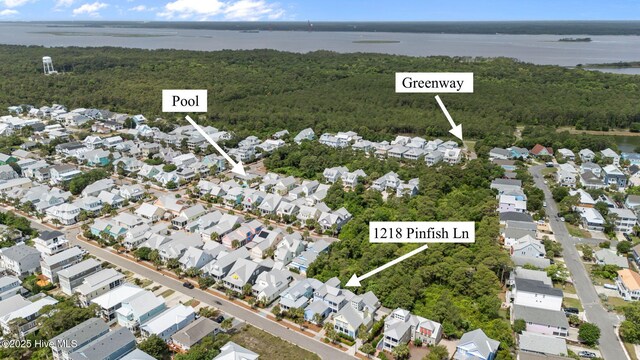 1218 Pinfish Ln, Carolina Beach, NC 28428 - aerial view of property and surrounding area with nearby suburban area, a forest, and a large body of water