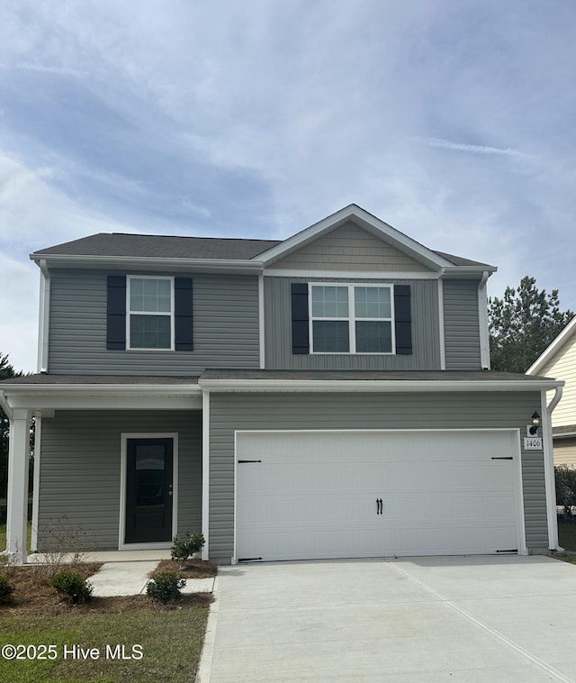 1406 Judith Dr SE, Bolivia, NC 28422 - view of front of home with a garage, concrete driveway, and covered porch