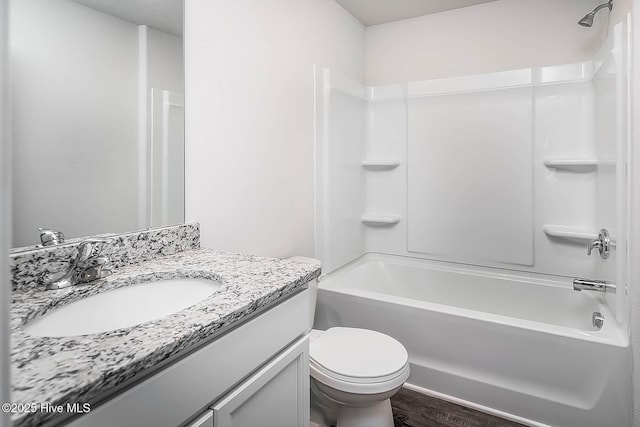 1406 Judith Dr SE, Bolivia, NC 28422 - bathroom featuring shower / bathtub combination, toilet, vanity, and wood finished floors