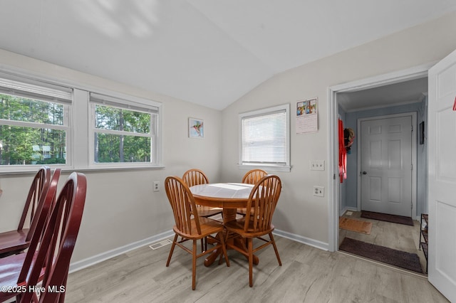 2285 Old Pamlico Beach Rd W, Belhaven, NC 27810 - dining room featuring lofted ceiling, light wood-type flooring, and baseboards