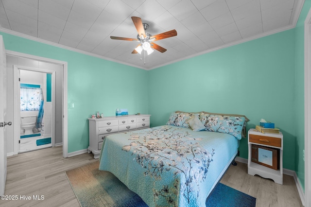 2285 Old Pamlico Beach Rd W, Belhaven, NC 27810 - bedroom with light wood-type flooring, crown molding, baseboards, and a ceiling fan