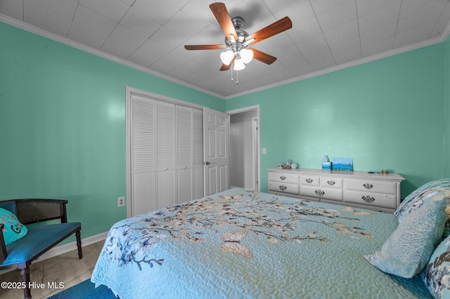 2285 Old Pamlico Beach Rd W, Belhaven, NC 27810 - bedroom with a closet, crown molding, a ceiling fan, baseboards, and carpet flooring