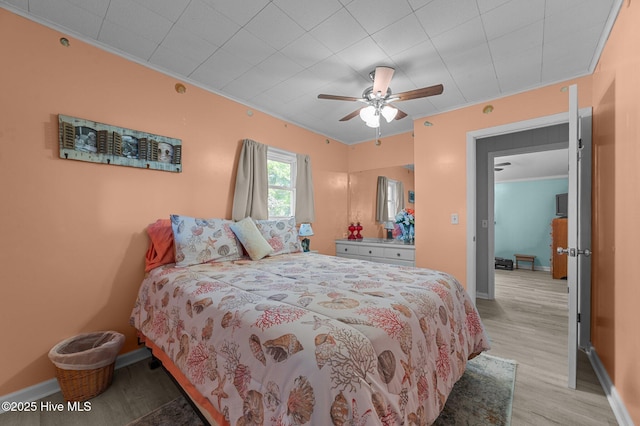2285 Old Pamlico Beach Rd W, Belhaven, NC 27810 - bedroom featuring crown molding, light wood-style floors, baseboards, and ceiling fan