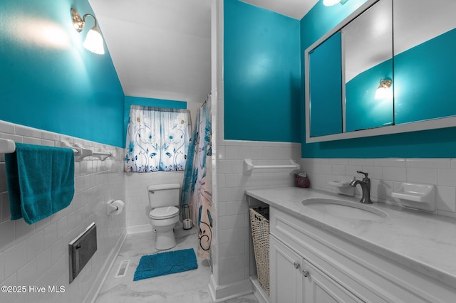 2285 Old Pamlico Beach Rd W, Belhaven, NC 27810 - full bathroom featuring tile walls, toilet, vanity, wainscoting, and marble look tile flooring