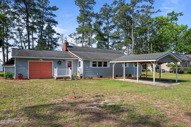 2285 Old Pamlico Beach Rd W, Belhaven, NC 27810 - view of front of property featuring a front lawn, a detached carport, a chimney, a garage, and crawl space