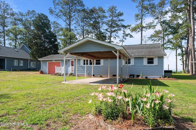 2285 Old Pamlico Beach Rd W, Belhaven, NC 27810 - view of front of house featuring a carport, a front lawn, an outbuilding, crawl space, and roof with shingles