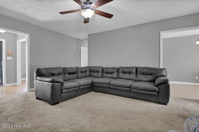 102 Rocky Ct, Richlands, NC 28574 - carpeted living room featuring a ceiling fan and baseboards