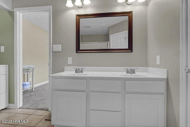 102 Rocky Ct, Richlands, NC 28574 - full bathroom featuring double vanity, a chandelier, baseboards, and tile patterned floors