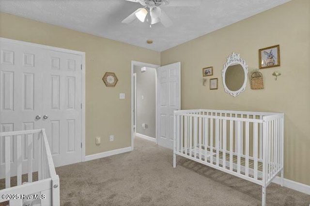 102 Rocky Ct, Richlands, NC 28574 - carpeted bedroom with baseboards, a closet, a ceiling fan, and a crib