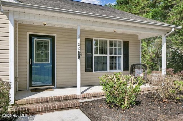 102 Rocky Ct, Richlands, NC 28574 - doorway to property with a porch and a shingled roof