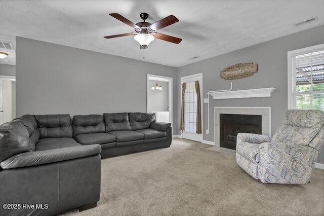 102 Rocky Ct, Richlands, NC 28574 - living area featuring a ceiling fan, carpet flooring, baseboards, and a fireplace with flush hearth