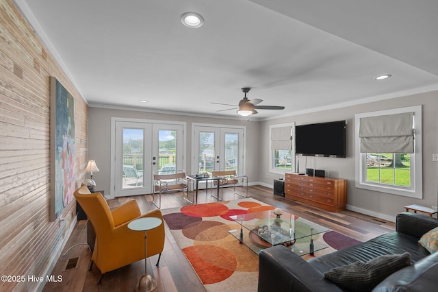 105 N Main St, Bath, NC 27808 - living area with french doors, plenty of natural light, crown molding, ceiling fan, and wood finished floors