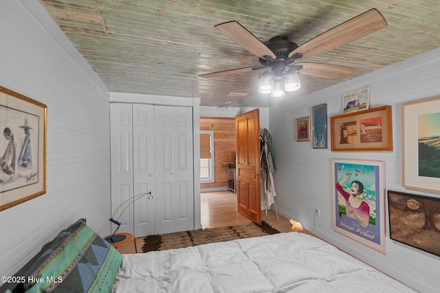 105 N Main St, Bath, NC 27808 - bedroom with wood ceiling, a closet, ceiling fan, wood walls, and wood finished floors