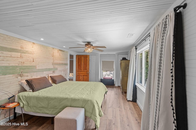 105 N Main St, Bath, NC 27808 - bedroom featuring wooden walls, light wood-type flooring, ceiling fan, and recessed lighting