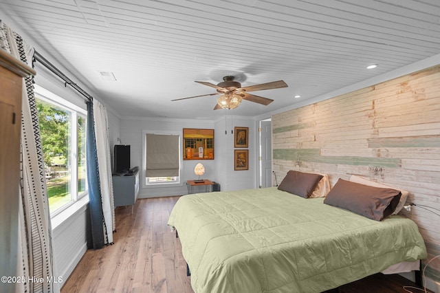 105 N Main St, Bath, NC 27808 - bedroom with wood walls, wood finished floors, and ceiling fan
