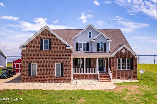 118 Durant St, Hertford, NC 27944 - traditional-style home with a porch, crawl space, brick siding, a front yard, and a shingled roof