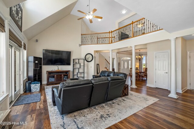 118 Durant St, Hertford, NC 27944 - living area featuring high vaulted ceiling, ornate columns, wood finished floors, a ceiling fan, and stairway