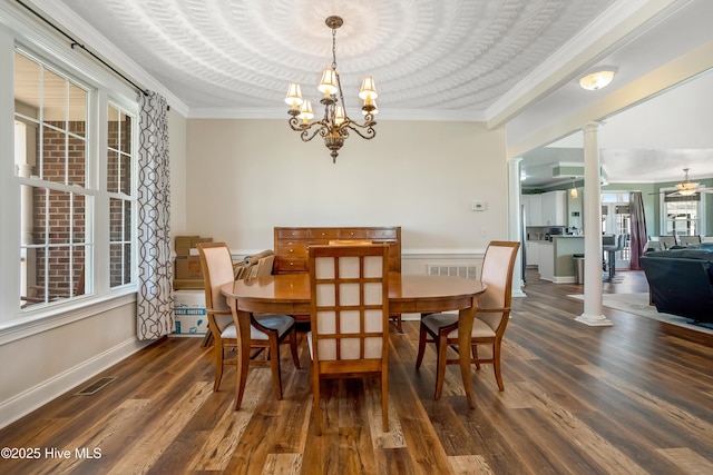 118 Durant St, Hertford, NC 27944 - dining space featuring decorative columns, ornamental molding, wood finished floors, a chandelier, and baseboards