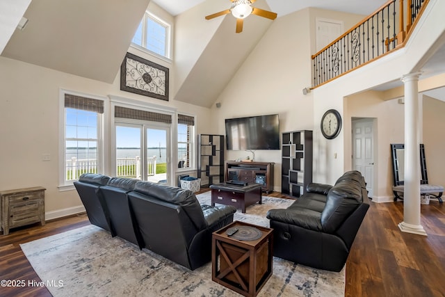 118 Durant St, Hertford, NC 27944 - living area featuring ornate columns, high vaulted ceiling, a ceiling fan, wood finished floors, and baseboards