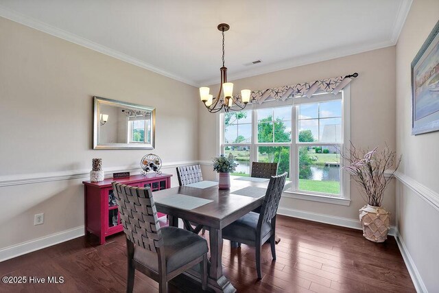 968 Woodwind Dr, Leland, NC 28451 - dining area with plenty of natural light, a chandelier, crown molding, and dark wood-style floors