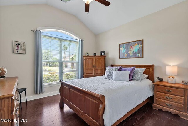 968 Woodwind Dr, Leland, NC 28451 - bedroom featuring dark wood-style flooring, multiple windows, vaulted ceiling, baseboards, and a ceiling fan