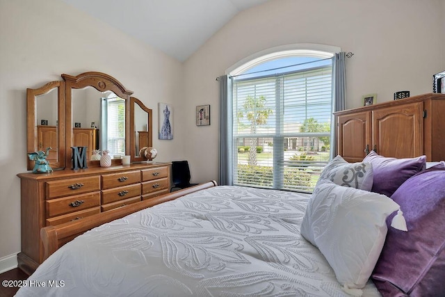 968 Woodwind Dr, Leland, NC 28451 - bedroom featuring lofted ceiling and multiple windows