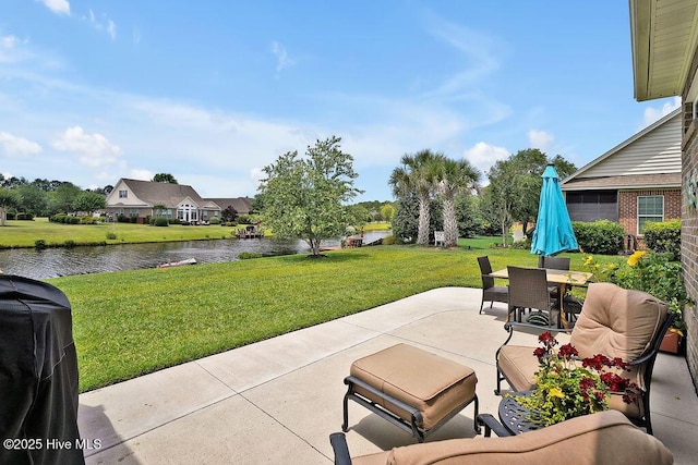 968 Woodwind Dr, Leland, NC 28451 - view of patio / terrace with a water view, outdoor dining area, and a grill