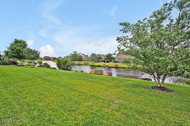 968 Woodwind Dr, Leland, NC 28451 - view of green lawn featuring a water view and a residential view